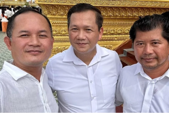 Hun To (right) is the cousin of Cambodian Prime Minister Hun Manet (middle)